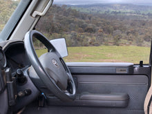 Shows armrests on driver's side of landcruiser